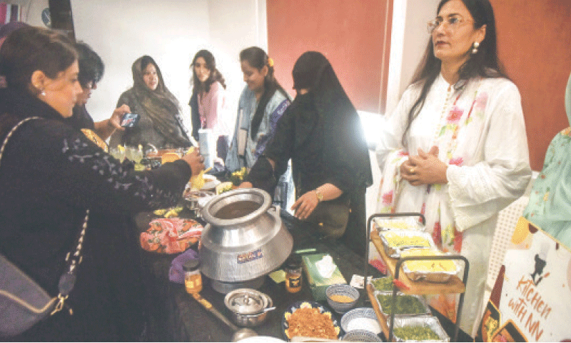Guests taste different types of nihari.&mdash;Fahim Siddiqi / White Star