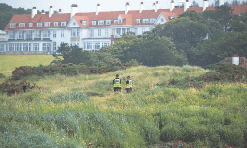 POLICE patrol in front of the Turnberry hotel, where US President Donald Trump will stay during his weekend visit to Scotland.—Reuters POLICE patrol in front of the Turnberry hotel, where US President Donald Trump will stay during his weekend visit to Scotland.—Reuters