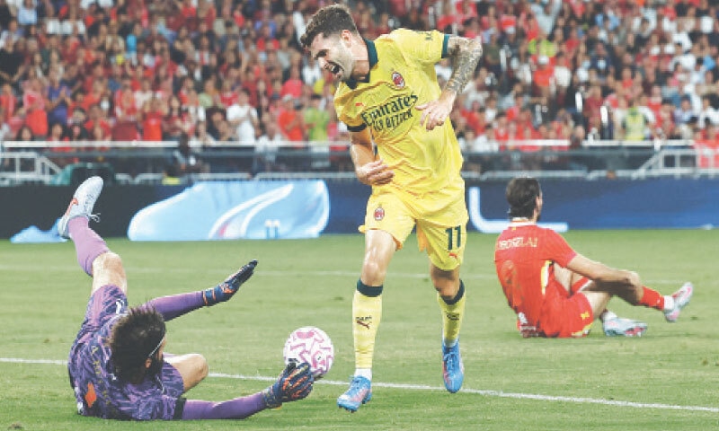 HONG KONG: Liverpool&rsquo;s Alisson Becker saves an effort from AC Milan&rsquo;s Christian Pulisic during their pre-season friendly at the Kai Tak Sports Park on Saturday.&mdash;Reuters