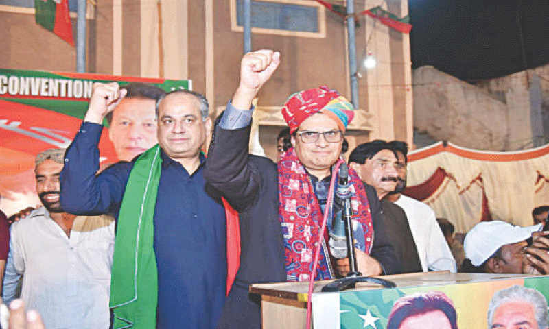 PTI Secretary General Salman Akram Raja waves his fist while speaking at the party convention.—Dawn PTI Secretary General Salman Akram Raja waves his fist while speaking at the party convention.—Dawn