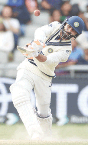 Indian batter Ravindra Jadeja hits a four during the fourth Test against England at Old Trafford 
on Sunday.&mdash;AFP