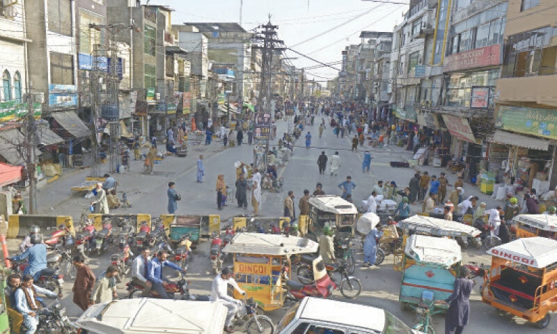 Traders demand opening of main road from Fawara Chowk to Hamilton Road (Dingi Khui) in Raja Bazaar for general traffic. — Dawn/File