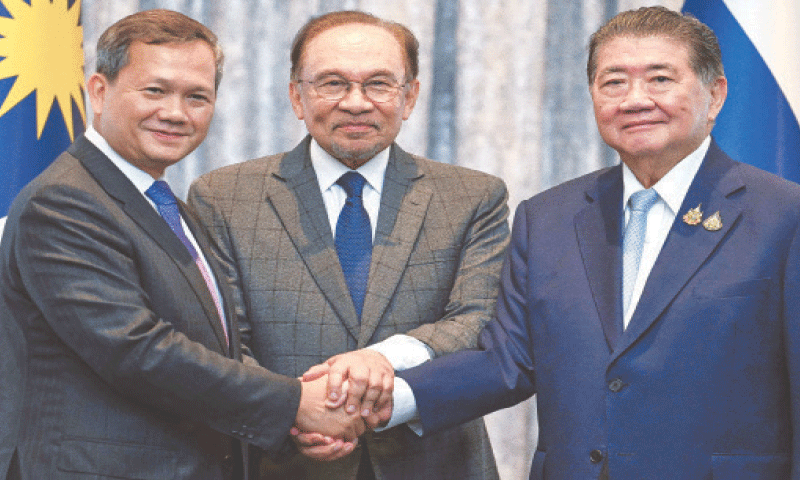 The prime ministers of Cambodia, Malaysia and Thailand, Hun Manet, Anwar Ibrahim and Phumtham Wechayachai, shake hands following a joint presser in Putrajaya, Malaysia.&mdash;Reuters