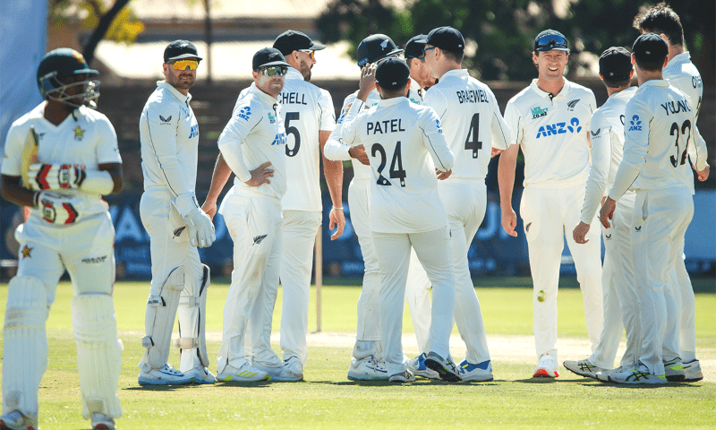 New Zealand players wait on the field after bowling out a Zimbabwe batsman on Friday. &mdash; @ZimCricketv on X