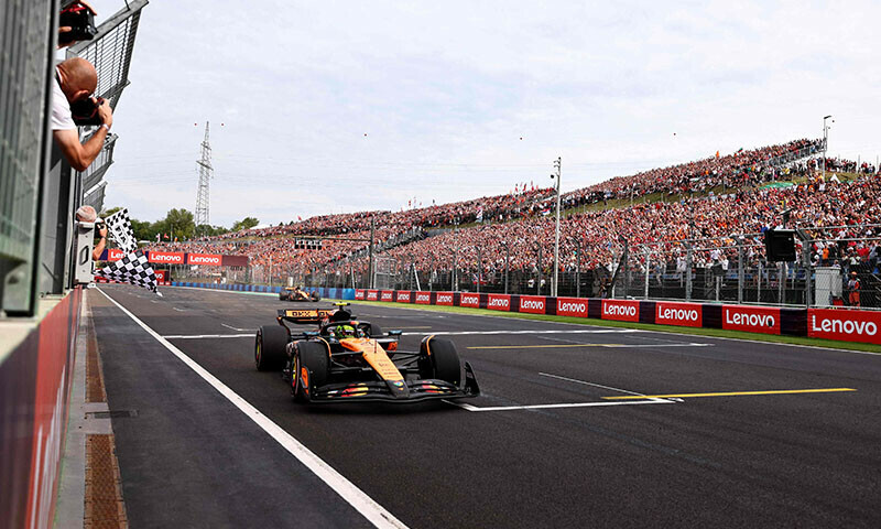 McLaren&rsquo;s British driver Lando Norris crosses the finish line to win the Formula One Hungarian Grand Prix at the Hungaroring circuit in Mogyorod near Budapest, Hungary, on August 3. &mdash; AFP