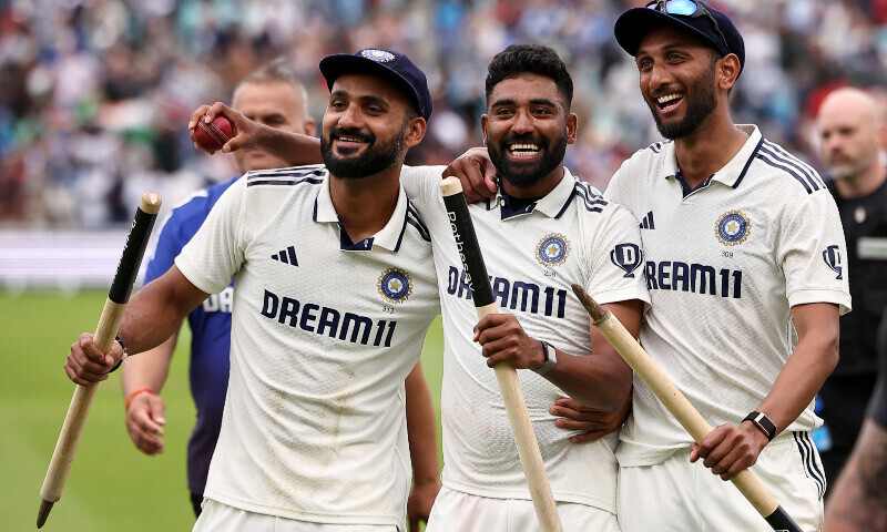India&rsquo;s Akash Deep (L) and Prasidh Krishna (R) hold the stumps and Mohammed Siraj holds the match ball after taking five wickets following their victory in the final Test cricket match between England and India at The Oval in London on August 4, 2025. &mdash; AFP