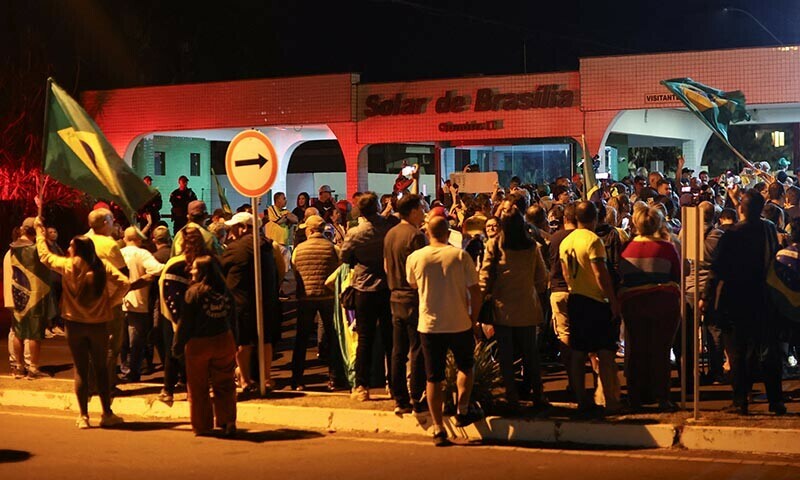 Supporters of former Brazilian President Jair Bolsonaro gather outside the residential development where the former Brazilian President lives, after Brazil&rsquo;s Supreme Court issued a house arrest order for him, in Brasilia, Brazil, August 4, 2025. &mdash; Reuters