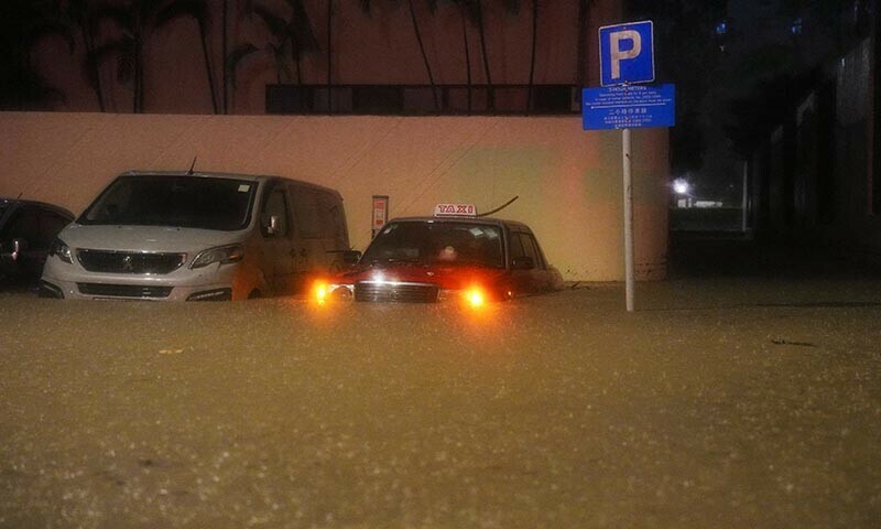 Vehicles are partially submerged at a flooded area during heavy rains, in Hong Kong, China on Aug 5, 2025. — Reuters