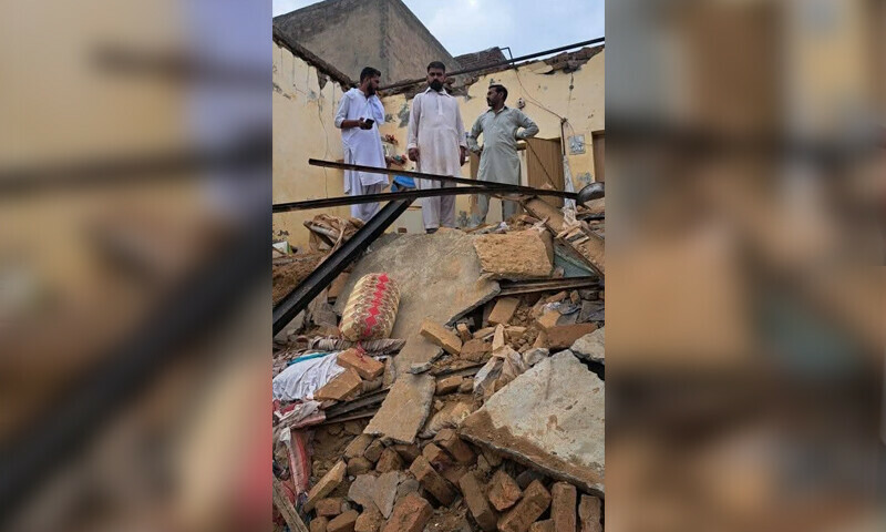 A photo of people standing above a collapsed roof that killed a 17-year-old girl and injured three others, in Gujar Khan tehsil on August 5, 2025. &mdash; via Hamid Asghar
