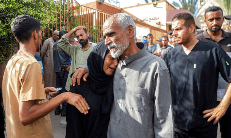 Mourners react during the funerals of victims who were killed during overnight Israeli bombardment on a camp sheltering displaced people in the Mawasi area of Khan Younis, as they gather at Nasser Medical Complex in Khan Younis in the southern Gaza Strip, August 5. — AFP