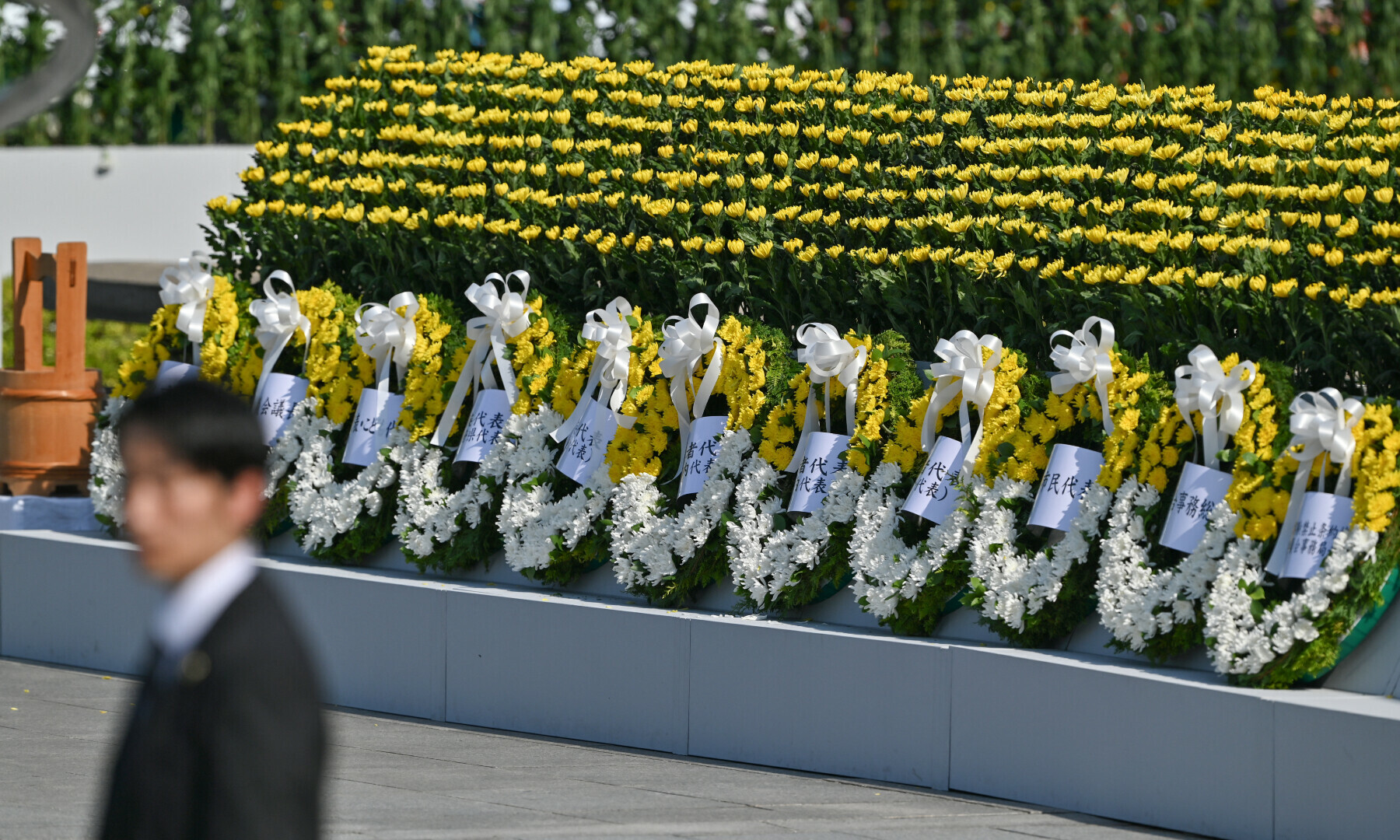 A line of floral wreaths is pictured after being placed there by officials during the Peace Memorial Ceremony to mark the 80th anniversary of the world’s first atomic bomb attack, in the city of Hiroshima on August 6, 2025. — AFP
