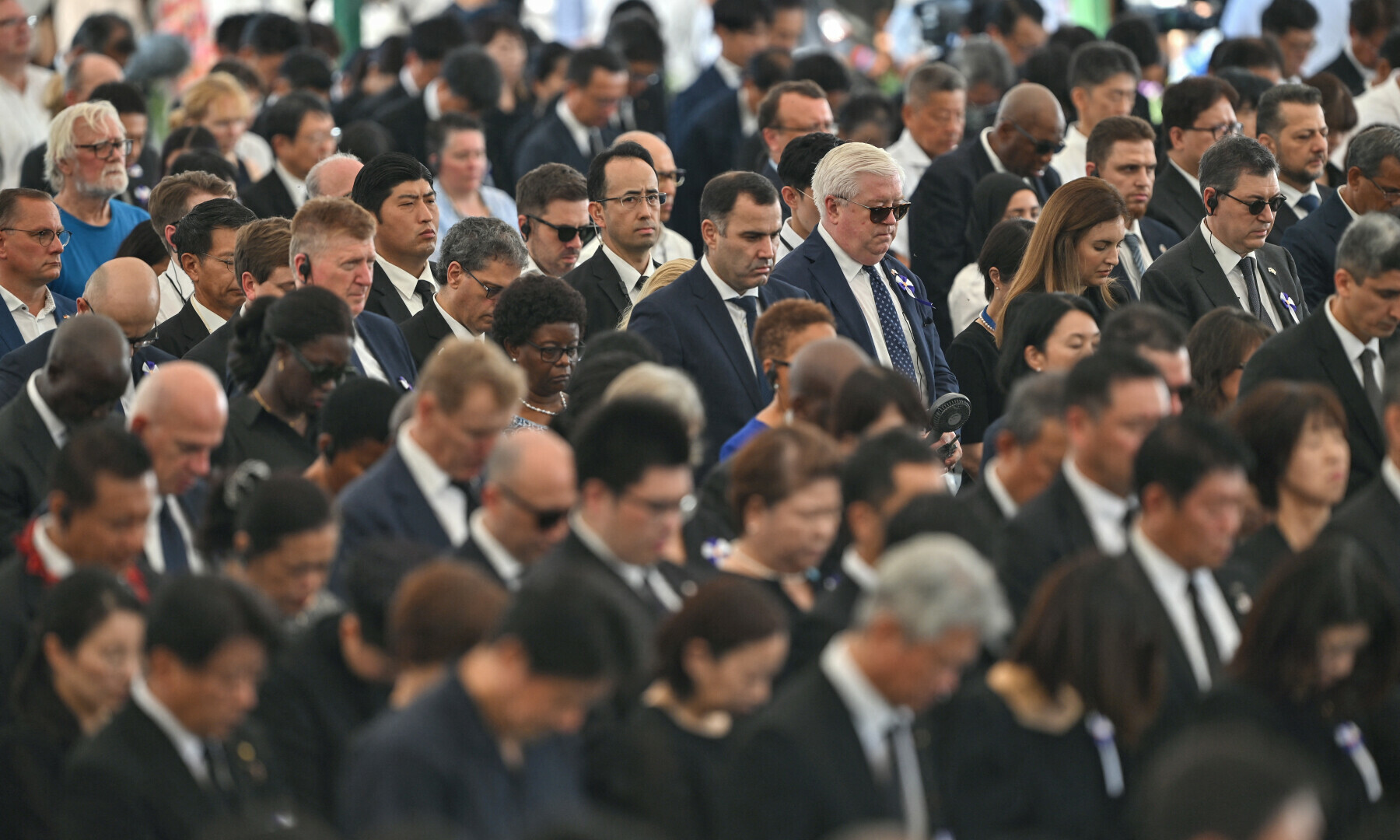 US Ambassador to Japan George Glass (top centre R - white hair and sunglasses) and other diplomats attend the annual memorial ceremony at the Hiroshima Peace Memorial Park to mark 80 years since the world’s first atomic bomb attack, in Hiroshima on August 6, 2025. — AFP