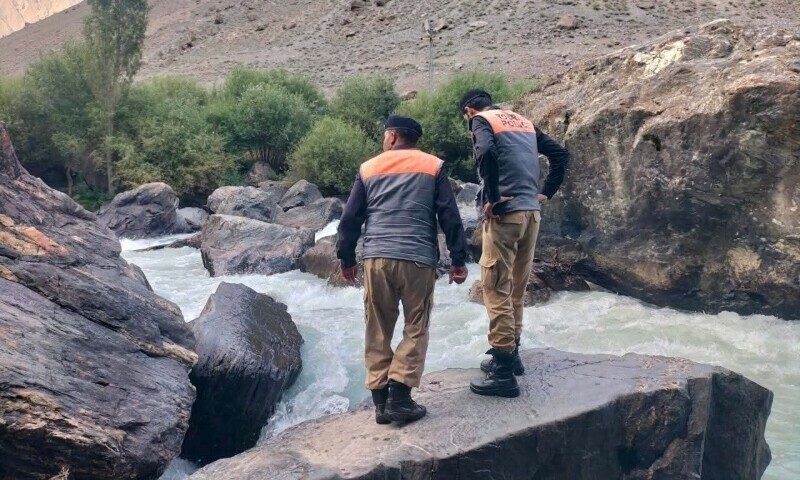 Rescue officials carry out a search operation to recover the body of a missing tourist in Skardu, Aug 6. &mdash; Rescue 1122
