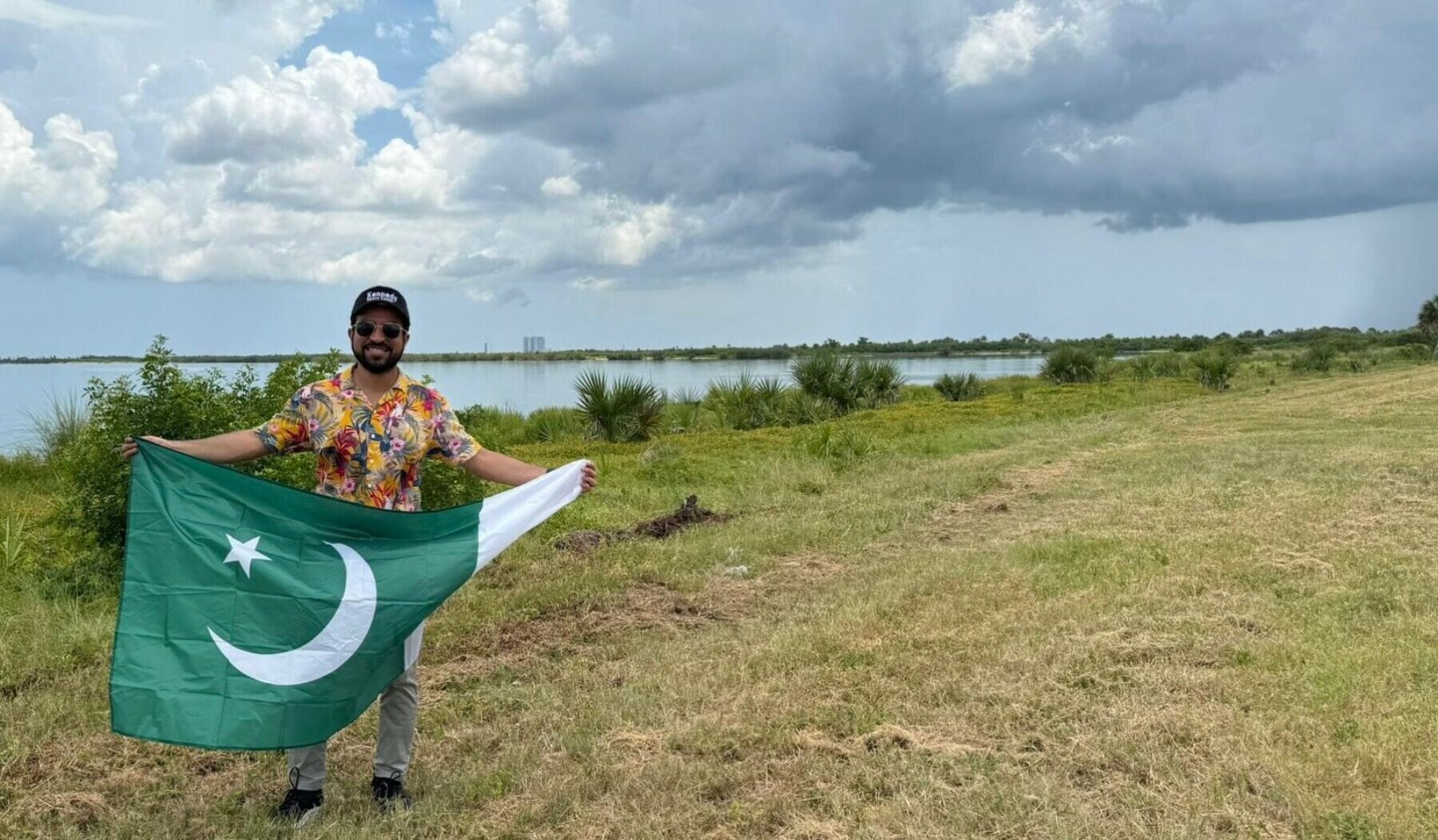 Mahhad holds Pakistan’s flag at the Kennedy Space Centre.