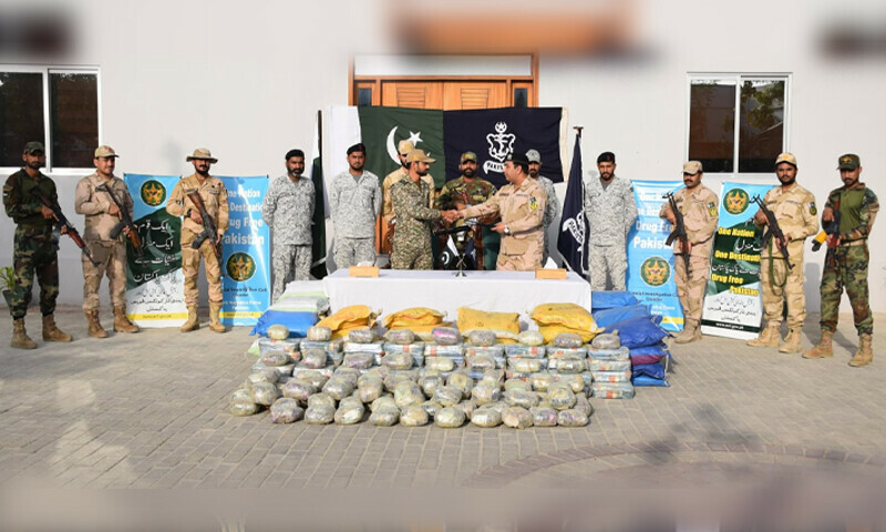 Officials of Pakistan Navy handing over the seized narcotics to Anti-Narcotics Force. &mdash; Pakistan Navy