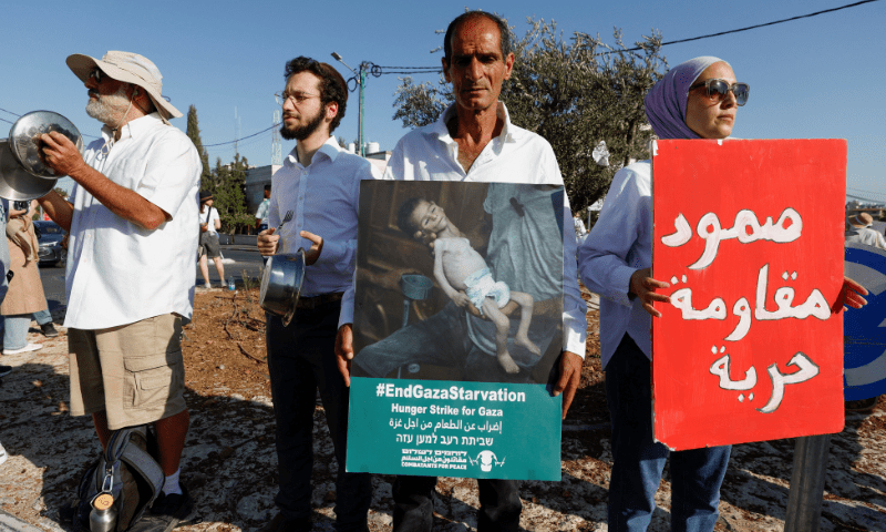  Palestinian and Israeli activists take part in a protest against starvation in Gaza, near Beit Jala in the Israeli-occupied West Bank on August 7, 2025. &mdash; Reuters 