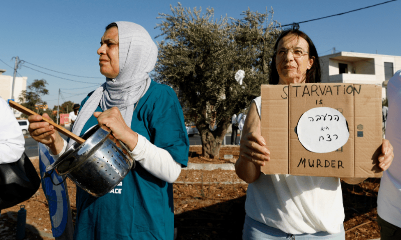  Palestinian and Israeli activists take part in a protest against starvation in Gaza, near Beit Jala in the Israeli-occupied West Bank on August 7, 2025. &mdash; Reuters 