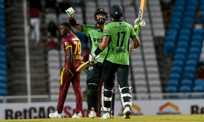 Hussain Talat (L) and Hasan Nawaz (R) celebrate winning the first ODI cricket match between West Indies and Pakistan at Brian Lara Cricket Academy in Tarouba, San Fernando, Trinidad and Tobago on Aug 8, 2025. &mdash; AFP