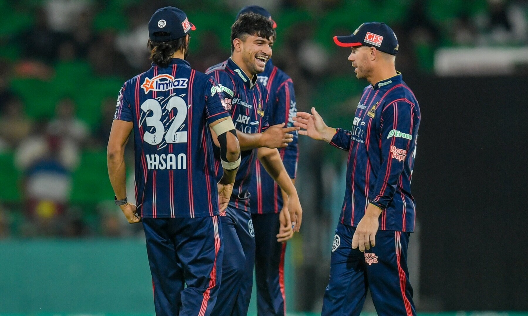  Fawad Ali celebrates with Hassan Ali and teammates after taking a wicket during the PSL X in Lahore in April. — Karachi Kings 