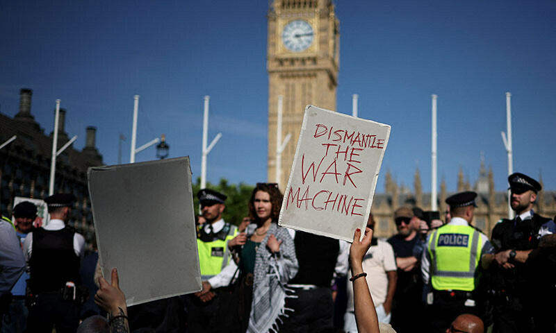 Protesters hold placards at a &lsquo;Lift The Ban&rsquo; demonstration in support of the proscribed group Palestine Action, calling for the recently imposed ban to be lifted, in Parliament Square, central London, UK on August 9. &mdash; AFP