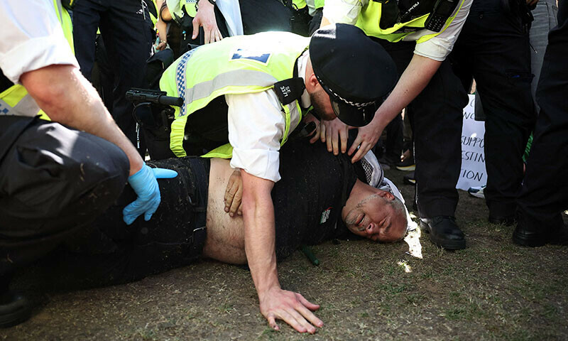 Police officers arrest a protestor at a &lsquo;Lift The Ban&rsquo; demonstration in support of the proscribed group Palestine Action, calling for the recently imposed ban to be lifted, in Parliament Square, central London, UK on August 9. &mdash; AFP