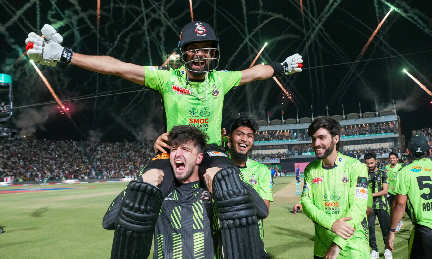 Lahore Qalandars Batter Sikandar Raza celebrates with his teammates after winning the PSL X final in Lahore on May 25. — X/PSL