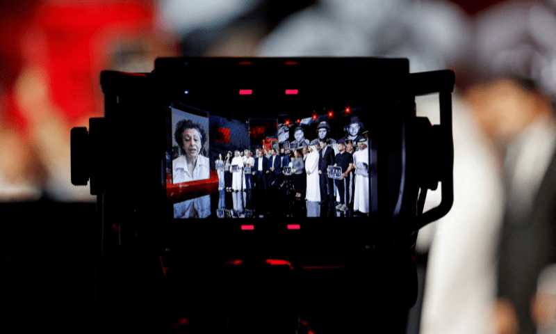  Al Jazeera staff members appear in a viewfinder as they gather at the network&rsquo;s studios to remember their colleagues Anas Al Sharif, Mohammed Qreiqeh, Ibrahim Zaher, Mohammed Noufal and another colleague, who were killed in Gaza City by an Israeli strike, in Doha, Qatar on August 11, 2025. &mdash; Reuters 