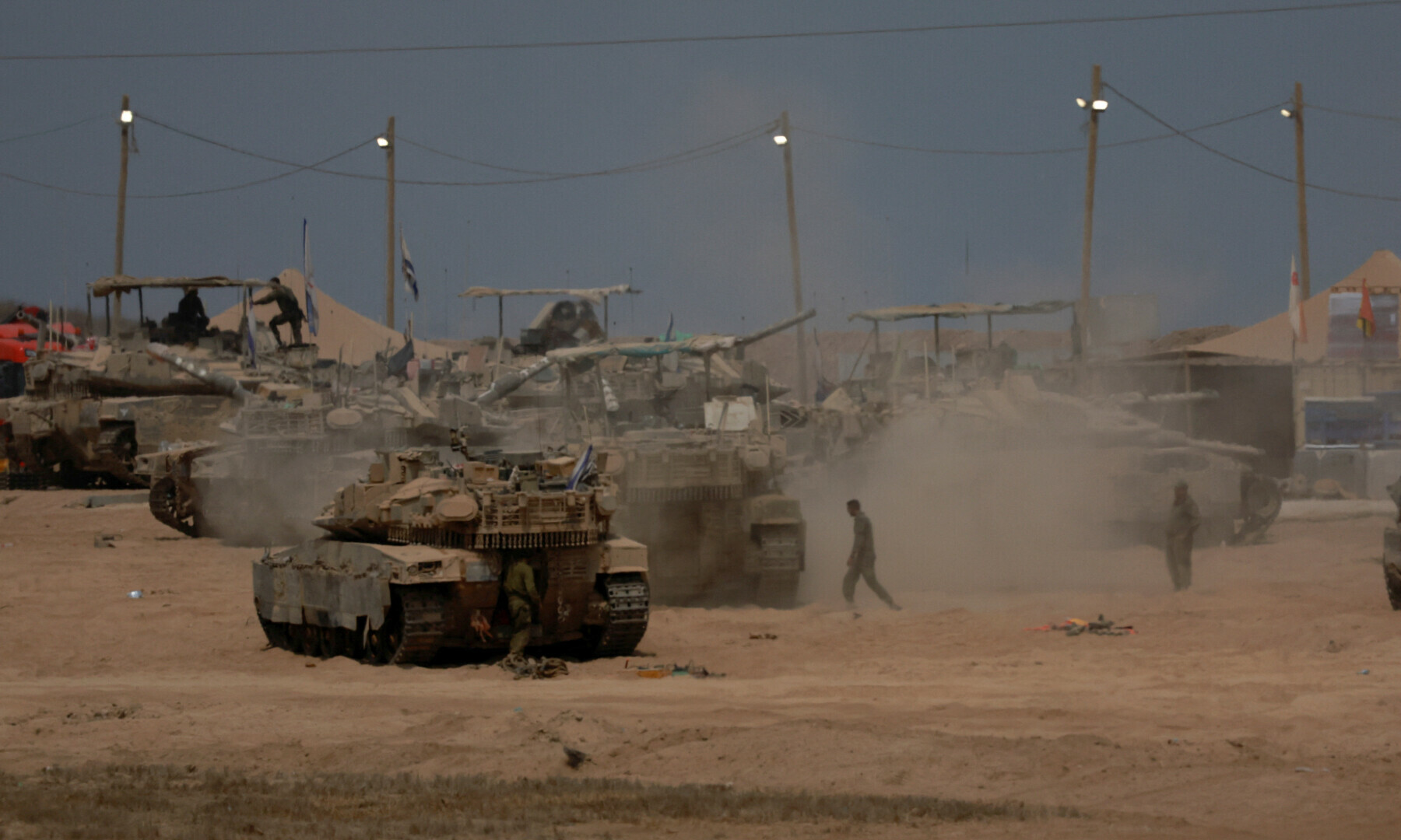 A view shows military vehicles on the Israeli side of the border with Gaza, as seen from Israel on Aug 12, 2025. — Reuters/Ammar Awad