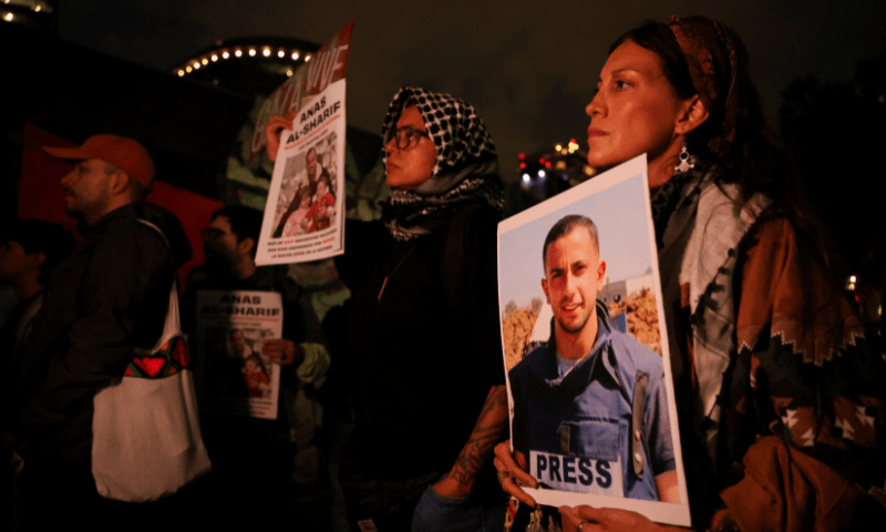 A demonstrator holds a photo of <em>Al Jazeera Arabic</em> correspondent Anas al-Sharif, who was killed along with his colleagues during an Israeli airstrike in Gaza on Sunday, amid the ongoing conflict between Israel and Hamas, at the Angel of Independence monument in Mexico City, Mexico on August 12, 2025. &mdash; Reuters 