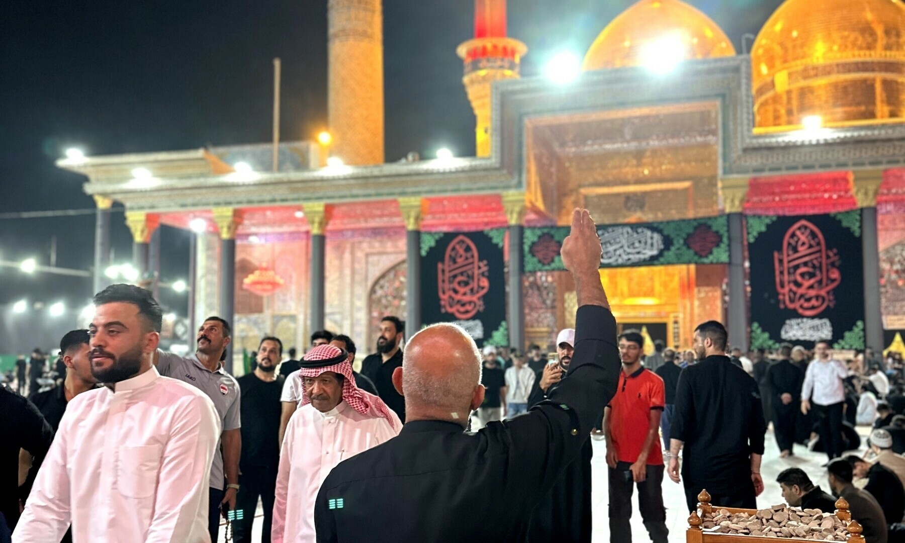 Pilgrims pay respect at the shrines in Kazmain.