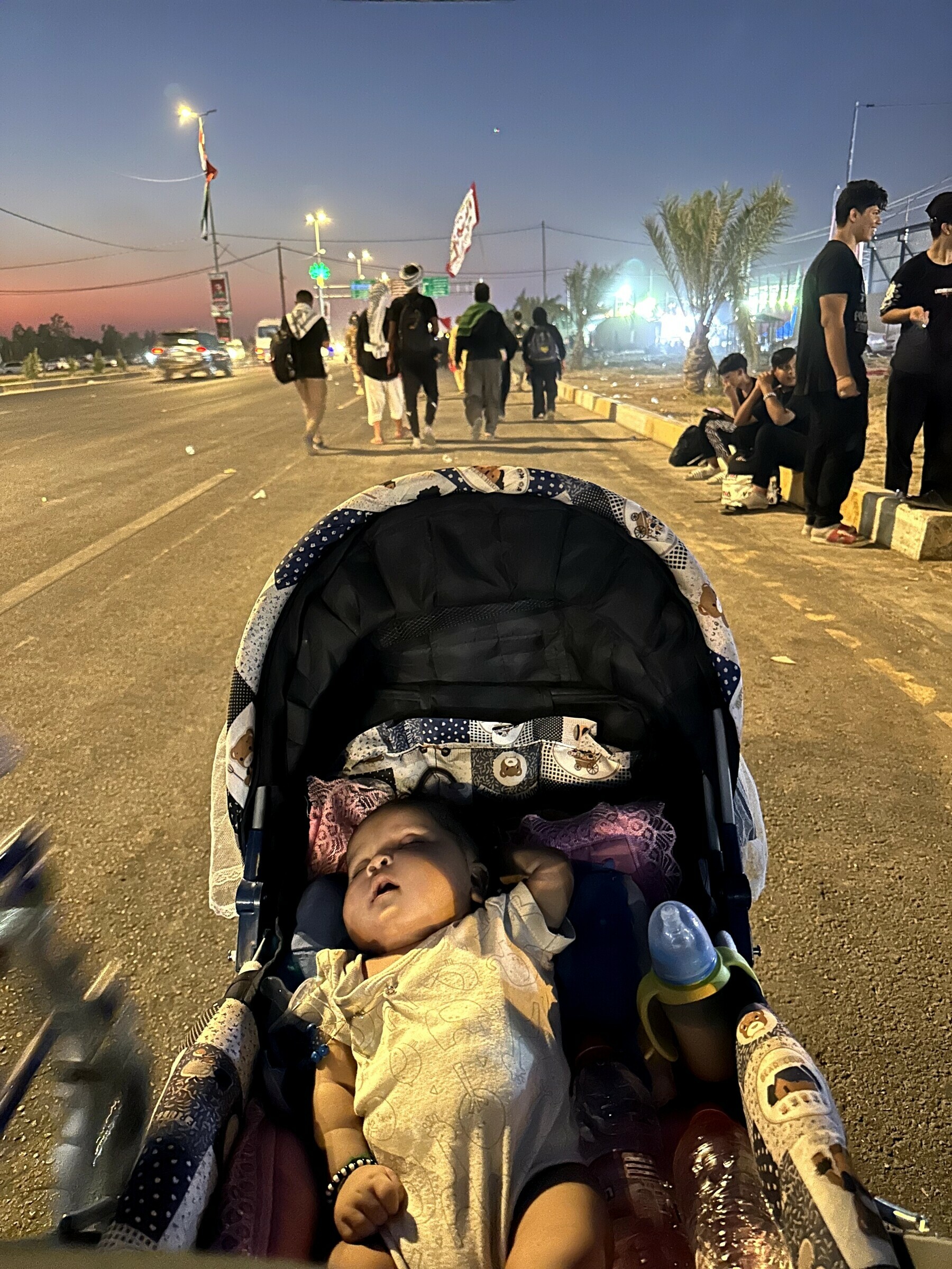 Walking along the highway to Karbala.