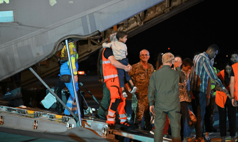  Medics and health personnel welcome Palestinian children from Gaza and their families, after an Italian military plane C130J from Israel landed on August 14, 2025, at Rome&rsquo;s Ciampino airport. &mdash; AFP 