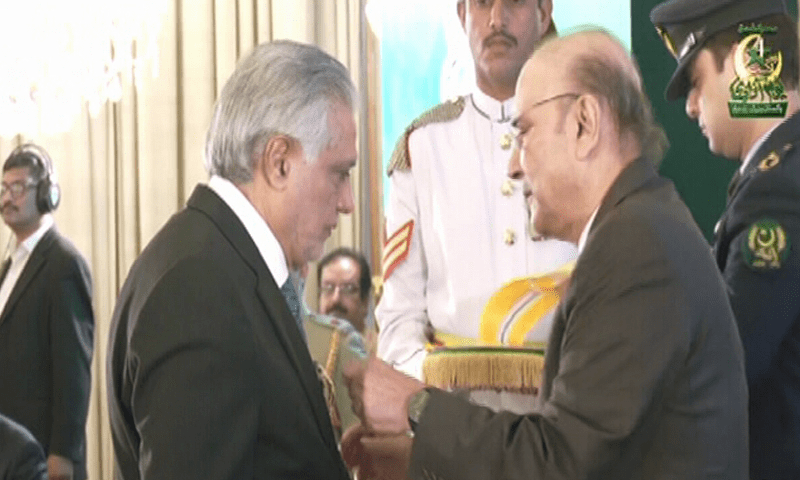 Deputy Prime Minister and Foreign Minister Ishaq Dar is presented the Nishan-i-Imtiaz by President Asif Ali Zardari during a ceremony at the Presidency on August 14. &mdash; DawnNewsTV