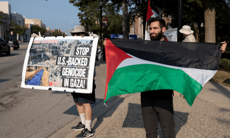  Palestinian-American Fady Islim holds a Palestinian flag during a vigil for Gaza in Dearborn, Michigan, US on August 14, 2025. &mdash; Reuters 