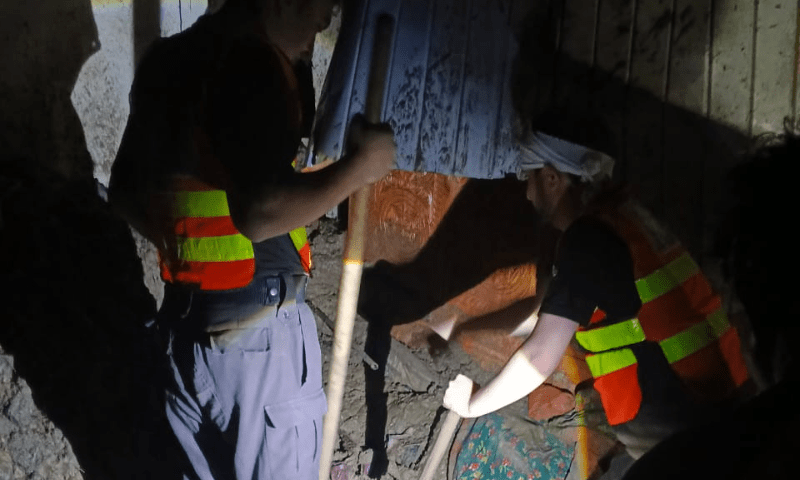Rescue personnel work to rescue people trapped under rubble due to rain-related accidents on Aug 15, 2025. — Rescue 1122 via Zahid Imdad