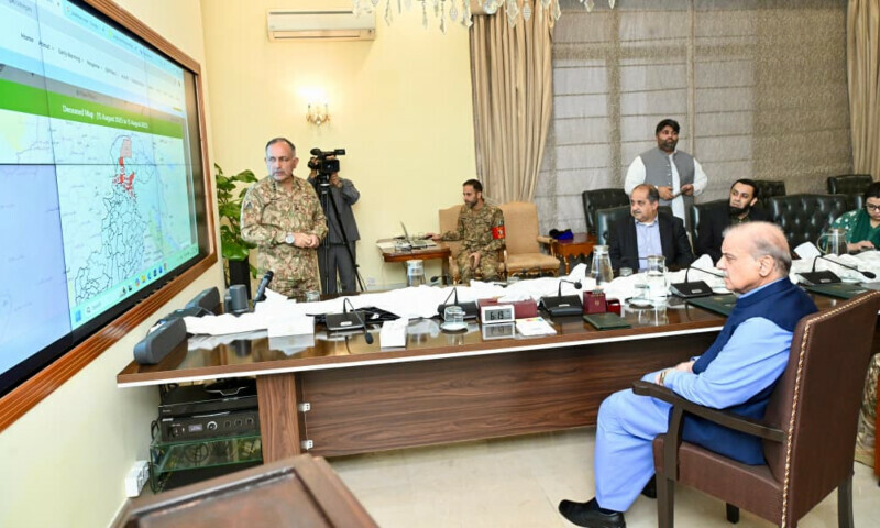 Prime Minister Shehbaz Sharif recieves a briefing by the NDMA chairman in Islamabad on August 15. &mdash; PMO