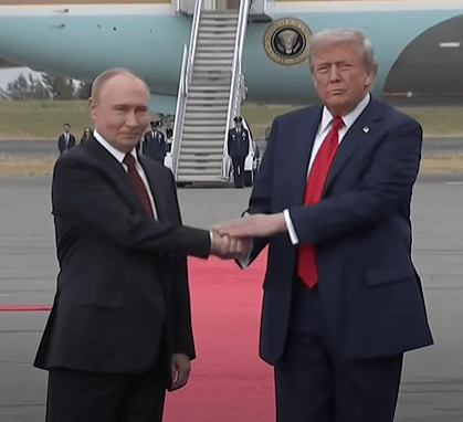 US President Donald Trump shakes hands with Russian President Vladimir Putin, as they meet to negotiate an end to the war in Ukraine, at a military base in Alaska. — screengrab via Reuters