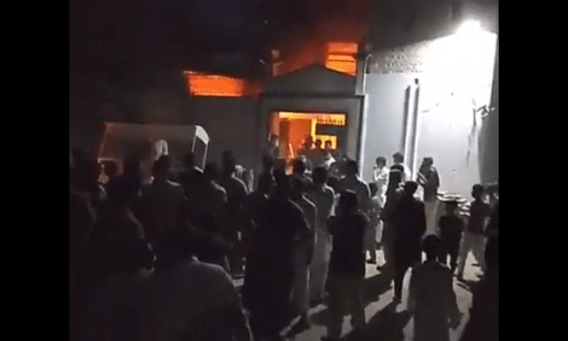 A TLP-led mob sets an Ahmadi worship place on fire in Faisalabad on Aug 13, 2025. &mdash; screengrab via X/theRealYLH