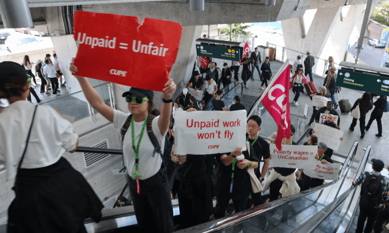Demonstrators display placards while riding an escalator as Air Canada flight attendants said they will remain on strike and challenge a return-to-work order they called unconstitutional, defying a government decision to force them back to their duties, at Vancouver International Airport in Richmond, British Columbia, Canada on August 17, 2025. — Reuters/File Demonstrators display placards while riding an escalator as Air Canada flight attendants said they will remain on strike and challenge a return-to-work order they called unconstitutional, defying a government decision to force them back to their duties, at Vancouver International Airport in Richmond, British Columbia, Canada on August 17, 2025. — Reuters/File