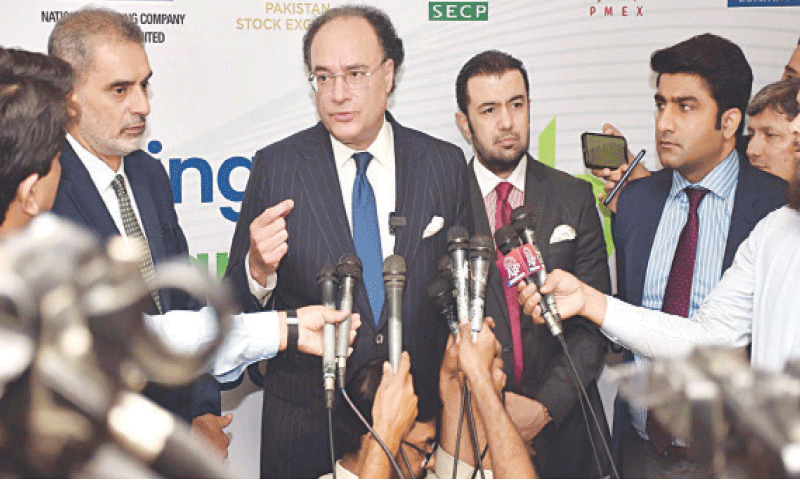 Finance Minister Muhammad Aurangzeb talks to the media on Monday.—APP Finance Minister Muhammad Aurangzeb talks to the media on Monday.—APP