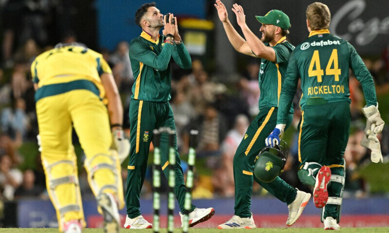 South Africa&rsquo;s Keshav Maharaj (C) celebrates with teammates after taking his fifth wicket of Australia&rsquo;s Aaron Hardie (L) during the first one-day international (ODI) cricket match between Australia and South Africa at Cazaly&rsquo;s Stadium in Cairns on August 19. &mdash; AFP