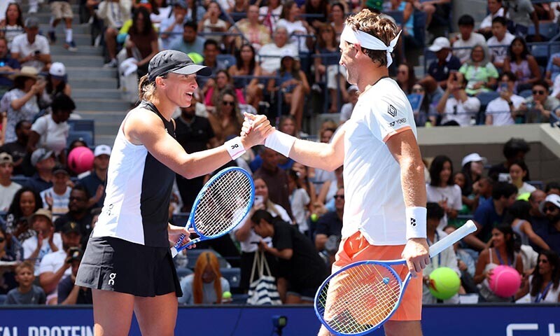 Poland&rsquo;s Iga Swiatek and Norway&rsquo;s Casper Ruud celebrate winning their round of 16 mixed doubles match against Madison Keys of the US and Frances Tiafoe of the US. &mdash; Reuters