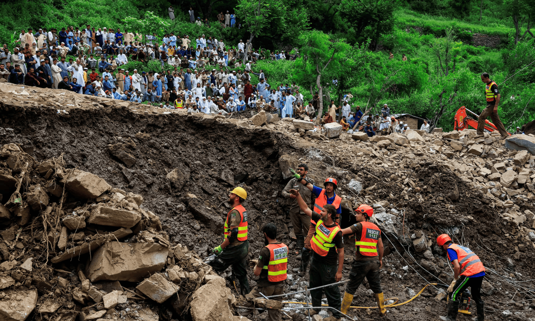  Residents gather as rescue workers look for victims, following a storm that caused heavy rains and flooding in Dalori Bala village in Gadoon district in Khyber Pakhtunkhwa province, Pakistan on August 19, 2025. &mdash; Reuters 