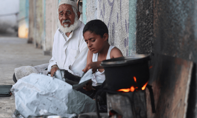  Palestinians displaced by the Israeli military offensive shelter in an UNRWA school, in Deir Al-Balah, in the central Gaza Strip on August 20, 2025. &mdash; Reuters 