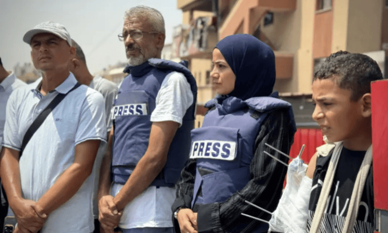 Journalists and Palestinians gather in front of Nasser Hospital to protest the killing of <em>Al Jazeera</em> journalists in an Israeli air strike on a journalists’ tent near al-Shifa Hospital in Gaza City on August 11, in Khan Younis, Gaza. — Anadolu