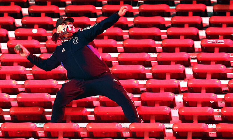  A fan of Universidad de Chile prepares to throw a stone during the interruption of the Copa Sudamericana football match between Argentina&rsquo;s Independiente and Chile&rsquo;s Universidad de Chile at the Libertadores de America stadium in Avellaneda, Buenos Aires province, Argentina, August 20. &mdash; AFP 