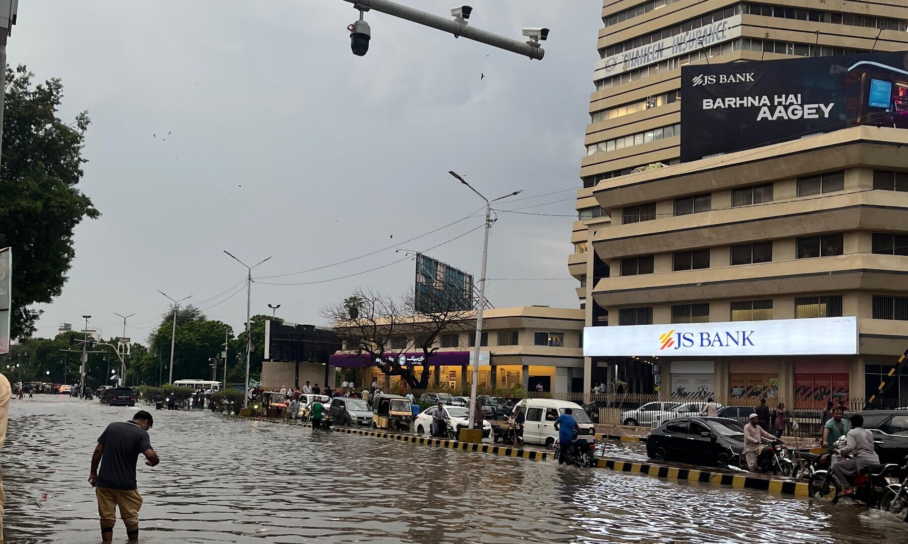 The main I.I. Chundrigar Road is inundated.