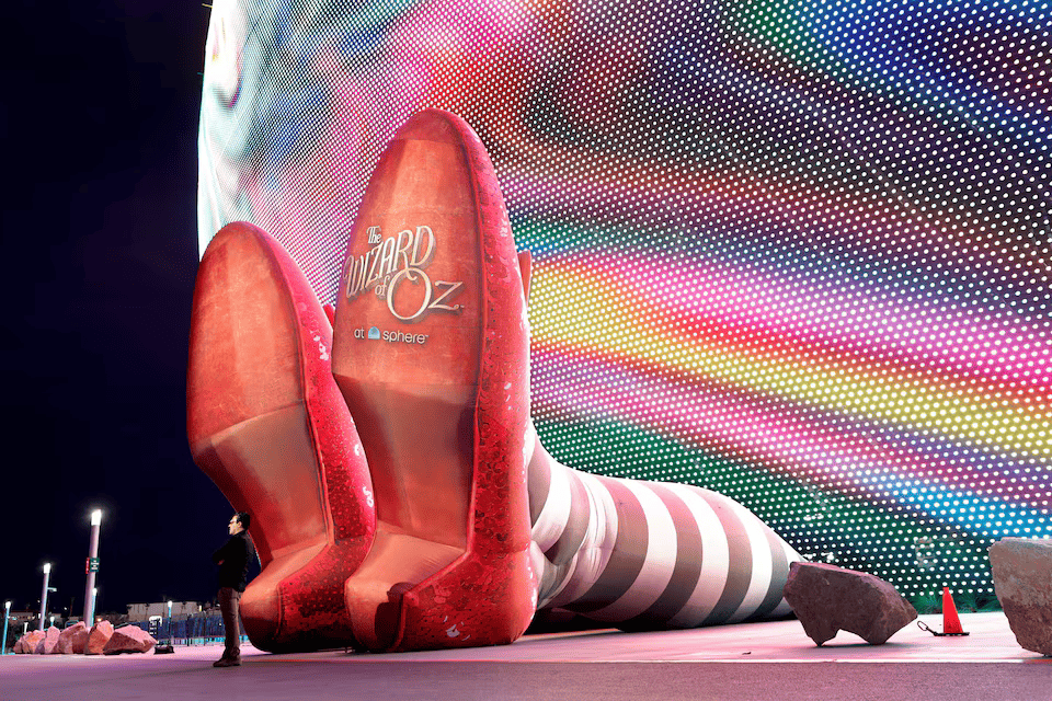  A display of 50-foot-long legs and 22-foot-tall ruby slippers, a promotion for the upcoming <em>Wizard of Oz at Sphere</em> movie, in Las Vegas. 