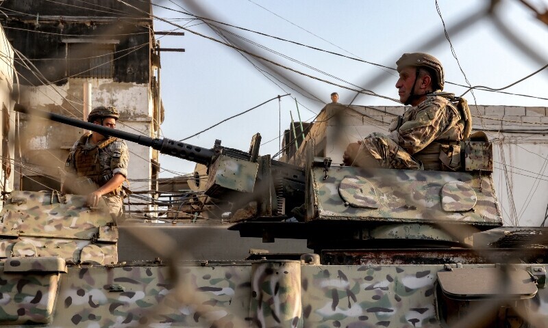 A Lebanese army soldier mans a turret atop an armoured personnel carrier stationed at the Burj al-Barajneh camp for Palestinian refugees in Beirut&rsquo;s southern suburbs on August 21. &mdash; AFP