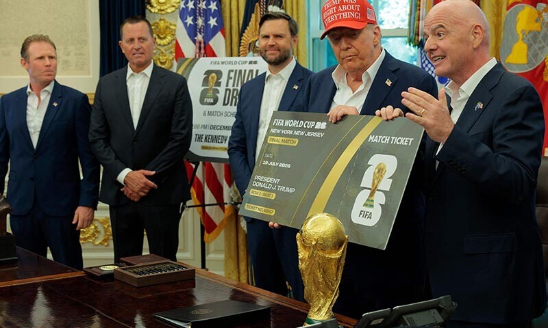 FIFA President Gianni Infantino talks as he and US President Donald Trump hold a large World Cup ticket replica in the Oval Office as Vice President JD Vance (3rd-L) looks on August 22, 2025 in Washington, DC. &mdash; AFP